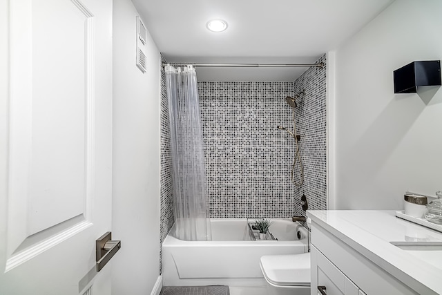 full bathroom with vanity, toilet, and shower / tub combo with curtain