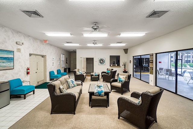 living room with light colored carpet, a textured ceiling, and ceiling fan