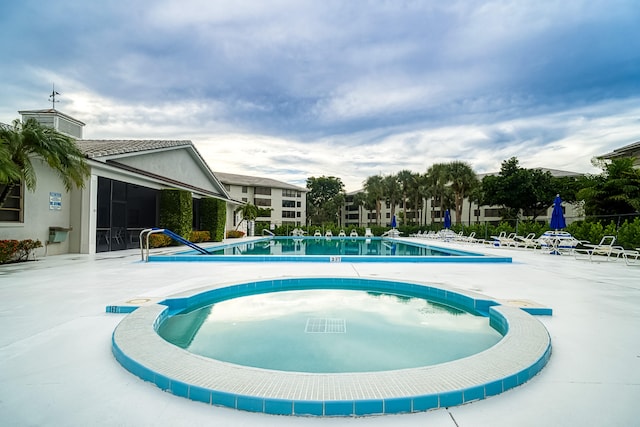 view of swimming pool with a patio