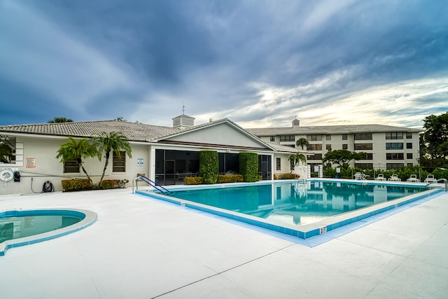 view of pool featuring a patio