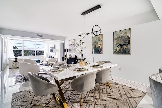 dining area with light tile patterned floors