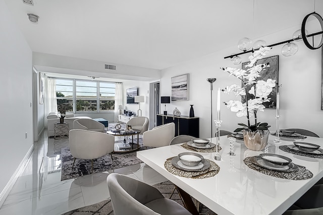 dining space with tile patterned floors