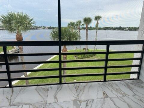 view of gate featuring a water view