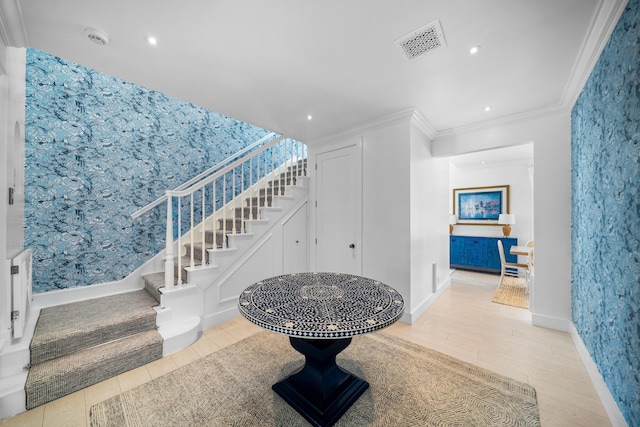 interior space featuring stairs, crown molding, wood finished floors, and visible vents