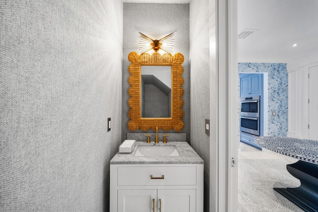 bathroom featuring vanity and visible vents