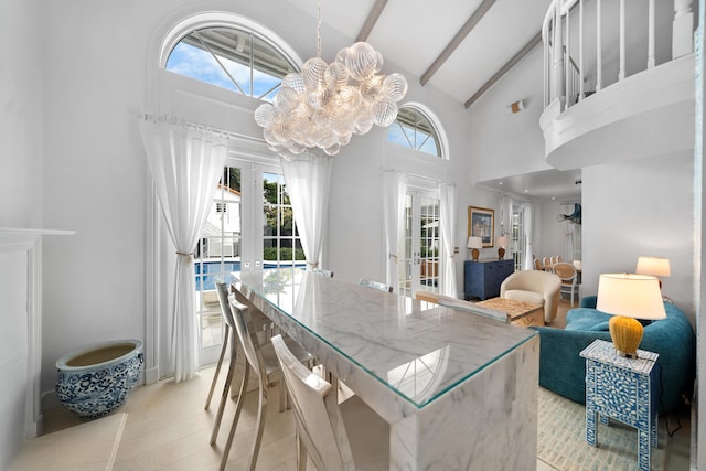 dining space with french doors, beam ceiling, high vaulted ceiling, and a chandelier