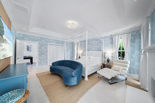 bedroom with visible vents, wallpapered walls, baseboards, and ornamental molding