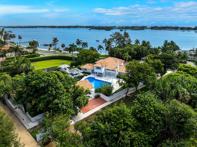birds eye view of property with a water view