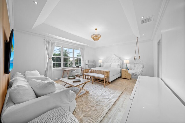 bedroom featuring light hardwood / wood-style flooring and ornamental molding