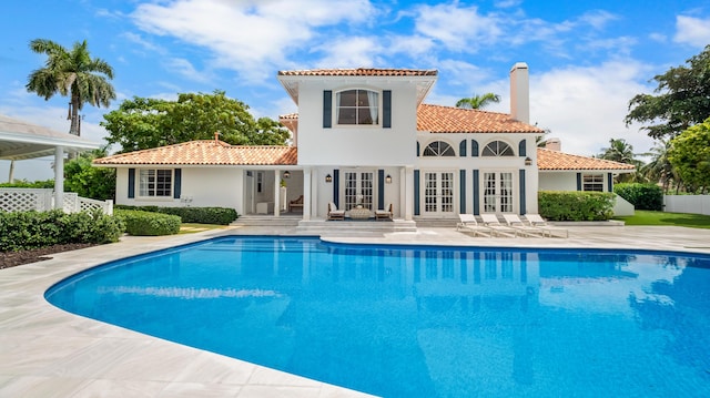 7515-7425 S Flagler Dr, West Palm Beach, FL 33405 - swimming pool featuring french doors and a patio