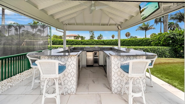 7515-7425 S Flagler Dr, West Palm Beach, FL 33405 - view of patio / terrace with area for grilling, wine cooler, and a gazebo
