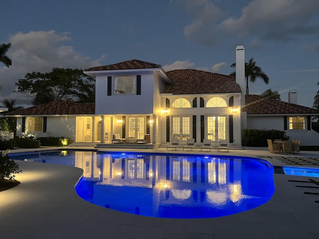 7515-7425 S Flagler Dr, West Palm Beach, FL 33405 - outdoor pool featuring french doors and a patio area