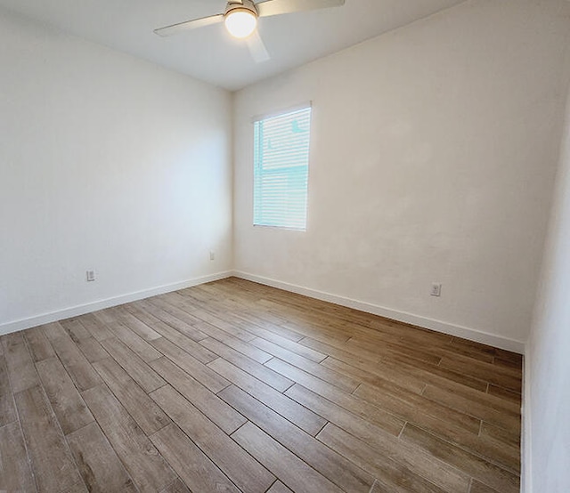 empty room featuring ceiling fan and light hardwood / wood-style floors