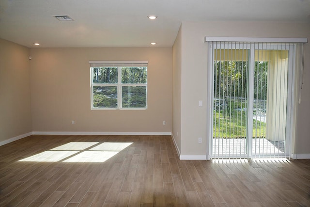 spare room featuring hardwood / wood-style flooring