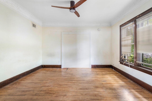 spare room featuring ornamental molding, ceiling fan, and hardwood / wood-style floors