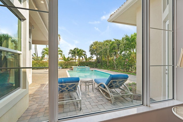 view of swimming pool featuring a patio area