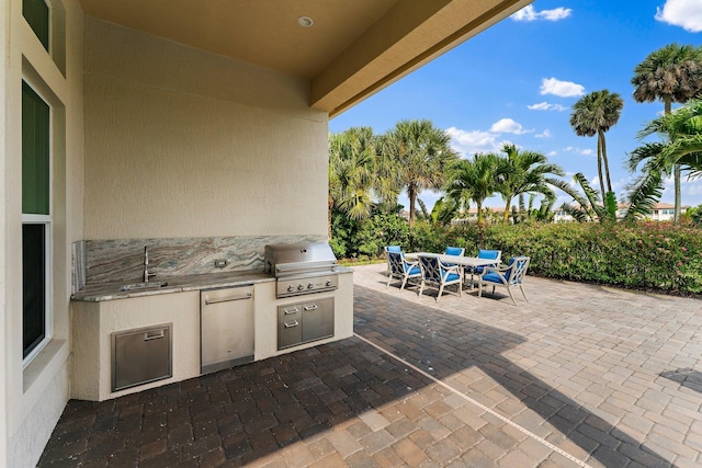 view of patio / terrace with sink, exterior kitchen, and area for grilling