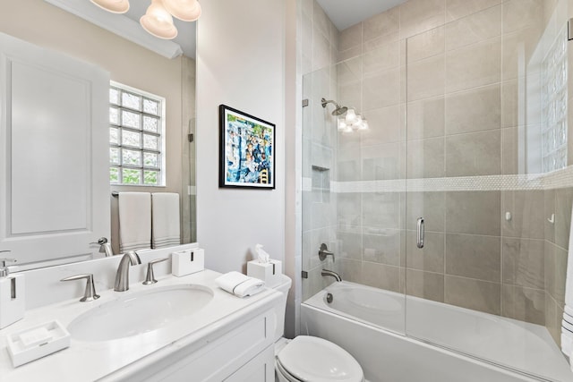 full bathroom featuring vanity, shower / bath combination with glass door, and toilet