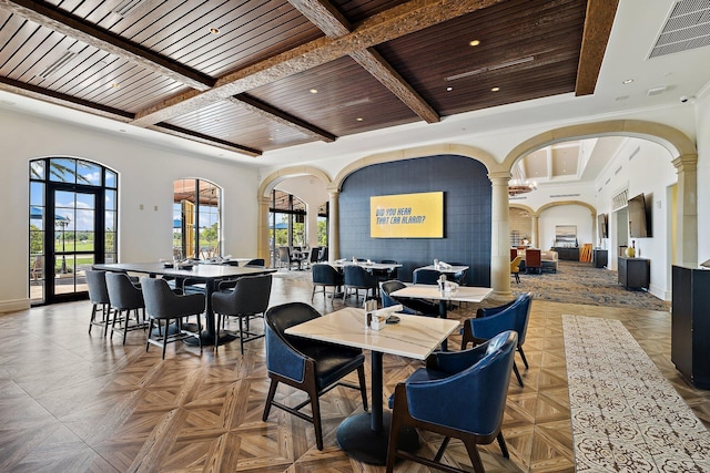 dining area with coffered ceiling, beamed ceiling, decorative columns, and wooden ceiling