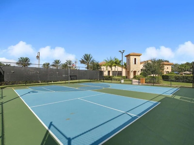 view of sport court featuring basketball hoop