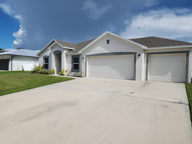 ranch-style house with a front yard and a garage