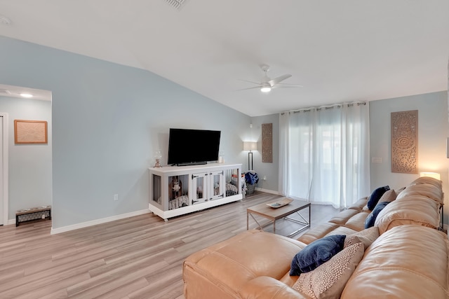 living room featuring ceiling fan, light hardwood / wood-style flooring, and lofted ceiling