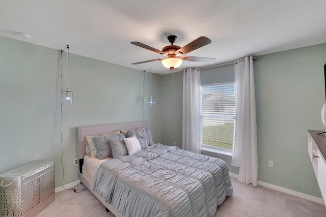 bedroom with light carpet and ceiling fan