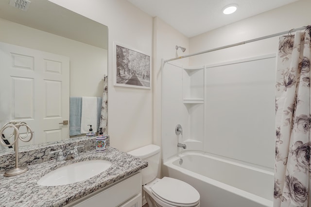 full bathroom featuring vanity, toilet, and shower / tub combo with curtain