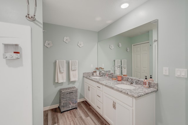 bathroom with wood-type flooring and vanity