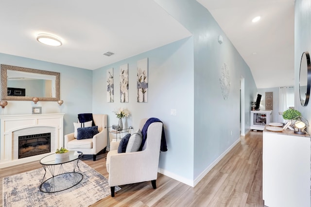 living room with light hardwood / wood-style flooring