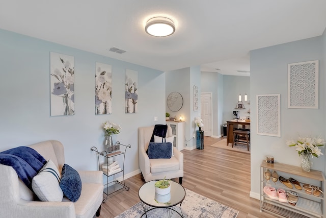 living area with light hardwood / wood-style floors