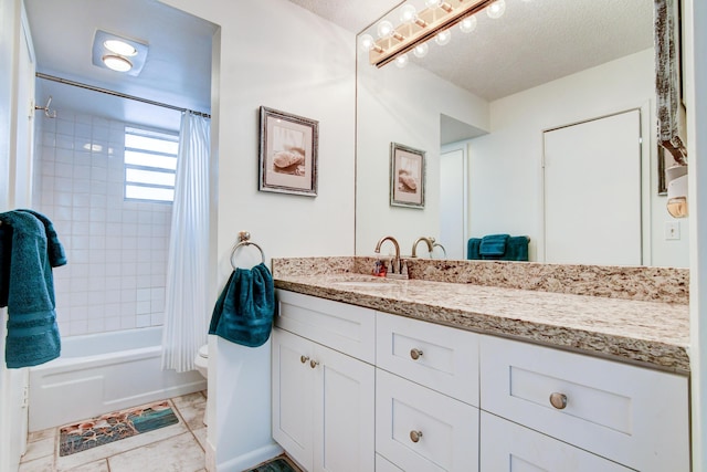 full bath with shower / bath combo with shower curtain, vanity, toilet, and a textured ceiling