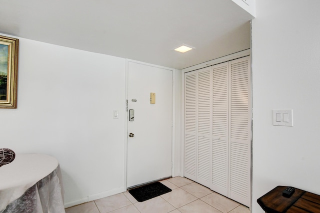 entryway with light tile patterned floors