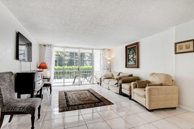 living room featuring light tile patterned floors, expansive windows, baseboards, and a textured ceiling