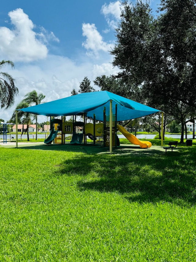 view of community featuring a lawn and a playground