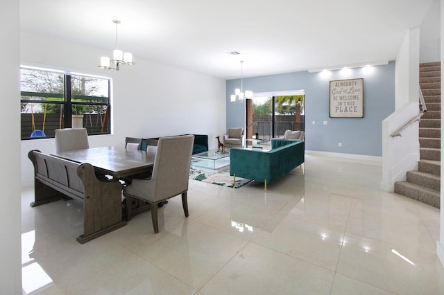 dining room featuring light tile patterned flooring and an inviting chandelier