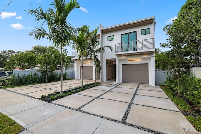 contemporary home with a balcony and a garage