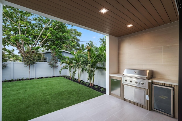 view of patio featuring an outdoor kitchen and area for grilling