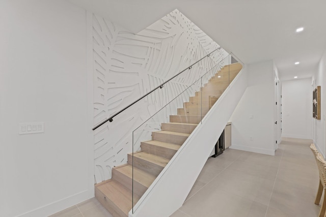 stairway with tile patterned flooring