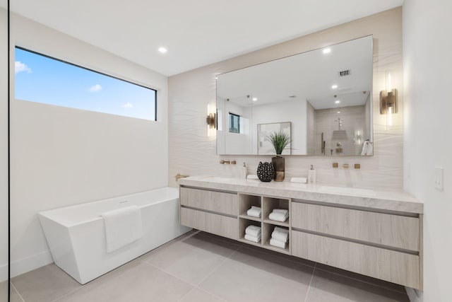 bathroom featuring vanity, tile patterned floors, and shower with separate bathtub