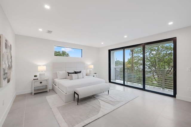 bedroom with multiple windows, access to outside, and light tile patterned flooring