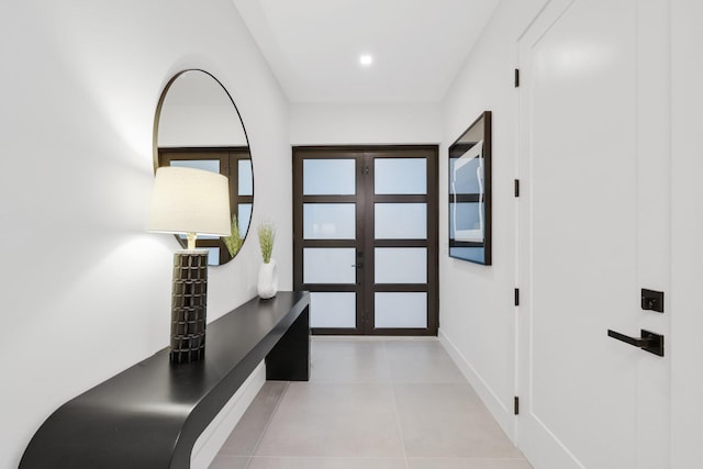 tiled entrance foyer featuring french doors