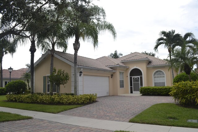 view of front of property with a garage