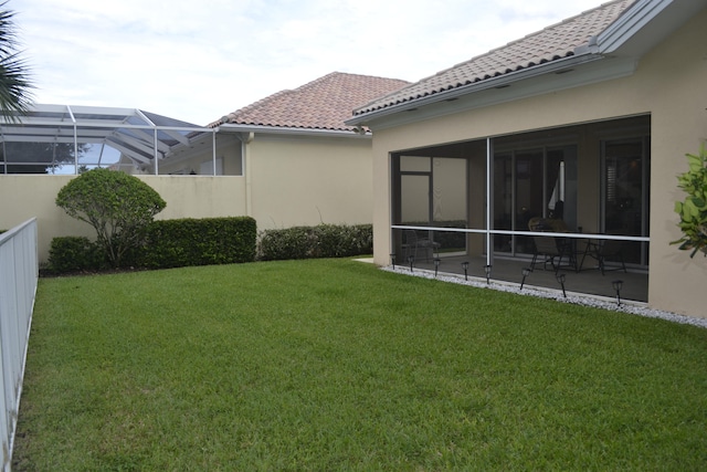 view of yard with a patio and a lanai