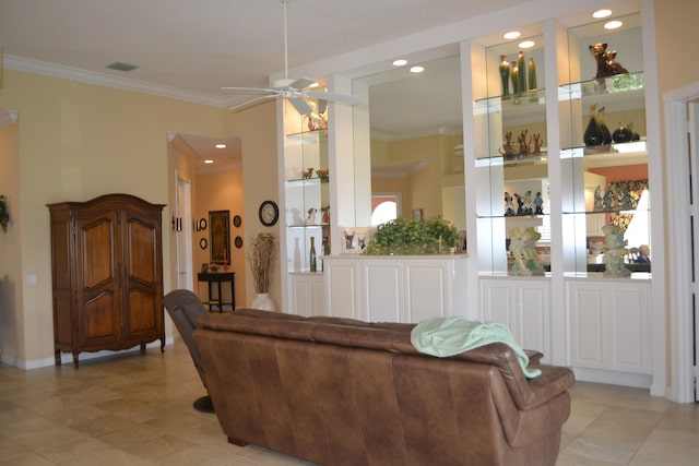 living room with ceiling fan, light tile patterned floors, and ornamental molding