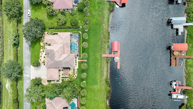 birds eye view of property featuring a water view