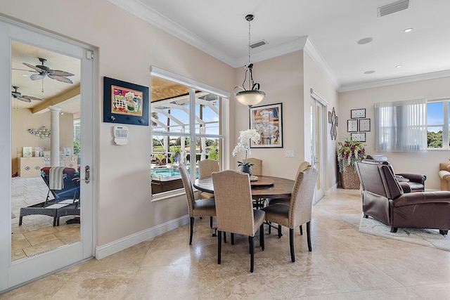 dining room with a wealth of natural light, visible vents, and baseboards