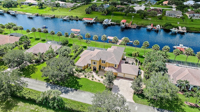 bird's eye view featuring a water view and a residential view