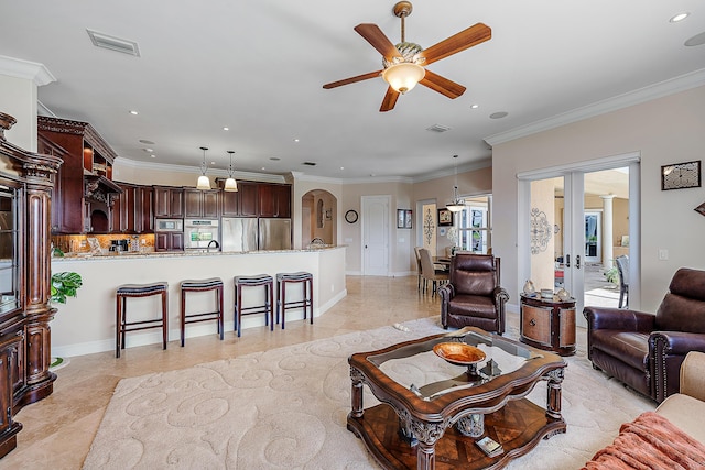 living room featuring visible vents, crown molding, and recessed lighting