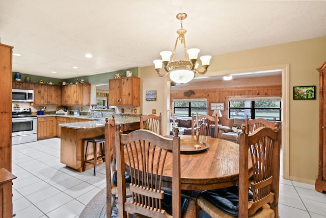 12390 Sandy Run, Jupiter, FL 33478 - dining room featuring a chandelier, light tile patterned flooring, and recessed lighting